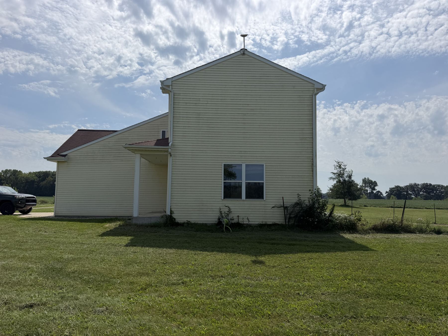 Gable end of the house, roof flush with the siding