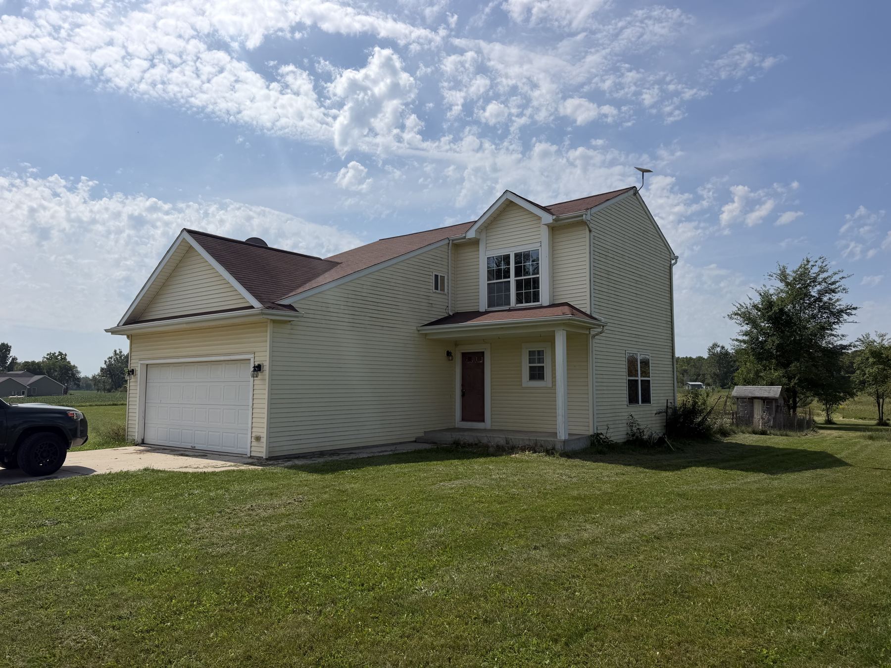 Front of the house with the garage and porch